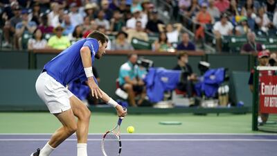 Cameron Norrie hits a return to Nikoloz Basilashvili. EPA