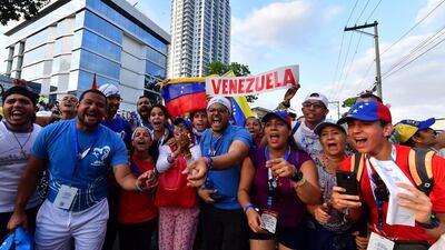 Venezuelan faithful wait to see Pope Francis after his arrival in Panama. AFP