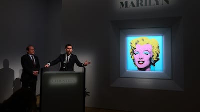 Christie’s Americas chairman Marc Porter, left, and Alex Rotter, Christie's chairman of 20th and 21st Century Art, as the auction house announces that it will put Andy Warhol’s 'Shot Sage Blue Marilyn' painting under the hammer on Monday. AFP