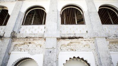 The removal of the outer layers of render from the walls of the palace courtyard has exposed the concrete reinforcement, introduced in the 1980s when this part of Qasr Al Hosn became the home of the National Centre for Documentation and Research. The work also revealed the mangrove wood lintels and stone ledger supports that were used in the construction of Sheikh Shakbhut’s new palace. Christopher Pike / The National