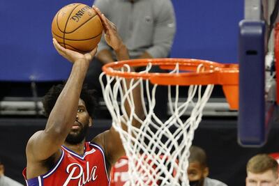 Joel Embiid of the Philadelphia 76ers attempts a three-point basket Getty