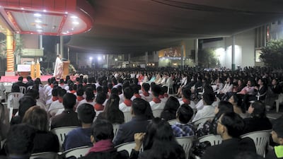 People join together to celebrate St Joseph's outdoor Christmas Eve Mass at St Joseph's Cathedral in Abu Dhabi. All photos: Chris Whiteoak / The National