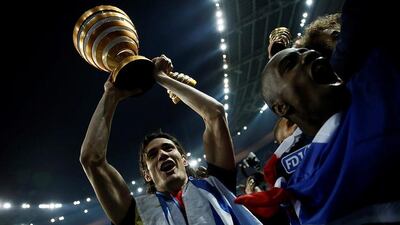 Edinson Cavani (L) of Paris St Germain celebrates after they won the French Coupe de la Ligue final soccer match between Paris Saint-Germain (PSG) and Lille at the Stade de France stadium in Paris, France, 23 April 2016. EPA/ETIENNE LAURENT