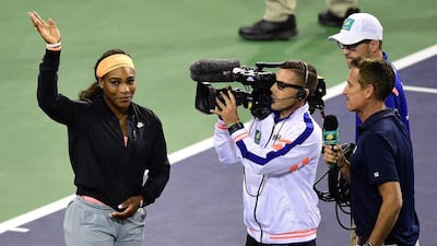 Serena Williams waves to the crowd after pulling out of the WTA Indian Wells tournament on Friday at the semi-final stage. Frederic J Brown / AFP / March 20, 2015