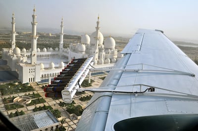 A cloud-seeding plane flies over Sheikh Zayed Grand Mosque in Abu Dhabi. Courtesy: National Centre for Meteorology and Seismology
