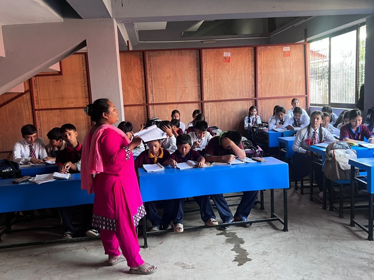 The community hopes authorities will set aside land for the new school building so they can move out of temporary classrooms set up in stairwells. Photo: Rajendra Dawadi