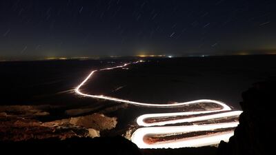 Cars drive through Ramon Crater during the Perseid meteor shower near the town of Mitzpe Ramon, southern Israel. Reuters