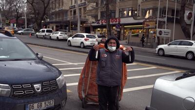 A garbage collector wearing a mask to help protect against the spread of coronavirus, pulls his cart in Ankara, Turkey. The number of confirmed daily COVID-19 infections in Turkey surpassed 40,000 on Thursday, hitting a record-high for a third straight day. The Health Ministry reported 40,806 new cases in past 24 hours, the highest since the start of the outbreak. It also reported 176 deaths, pushing the fatality toll to 31,713. AP Photo