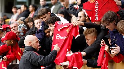 Erik ten Hag, manager of Manchester United signs autographs. Getty Images
