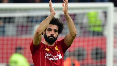 Liverpool's Egyptian midfielder Mohamed Salah greets the fans following the FIFA Club World Cup semi-final win over Monterrey. AFP
