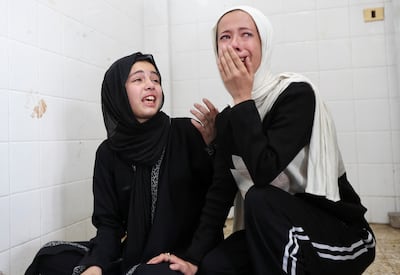 Palestinians mourn those killed in an Israeli strike on Deir Al Balah. Reuters