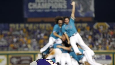 LSU shortstop Kramer Robertson (3) reacts as Coastal Carolina celebrates after LSU lost in the bottom if the ninth inning of an NCAA college baseball tournament super regional game in Baton Rouge, La., Sunday, June 12, 2016. Coastal Carolina advanced to the College World Series. Gerald Herbert / AP Photo