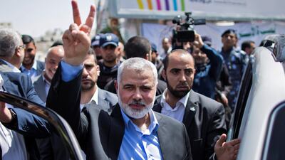 Hamas chief Ismail Haniyeh flashes a victory sign after visiting protesters taking part in a sit-in on May 8, 2017 in Gaza City in support of Palestinian hunger-striking prisoners in Israeli jails. Mahmud Hams / AFP