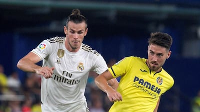 Real Madrid's Gareth Bale (L) in action against Villarreal's Moi Gomez (R) during a Spanish LaLiga soccer match between Villarreal and Real Madrid at the Ceramica stadium in Villarreal, eastern Spain. EPA
