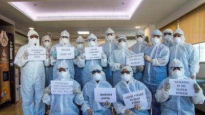 A group of nurses at a dedicated hospital in Sonapur, Dubai, that has reopened care specifically for moderate to severe Covid-19 patients. The nurses hold up signs to show their support, chat with patients to give them strength while also monitoring and treating those admitted. All pictures courtesy: of Aster DM Healthcare