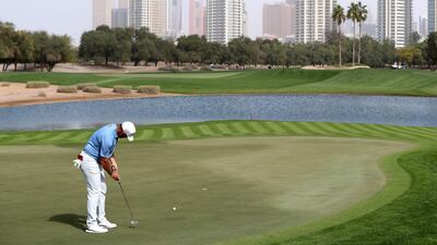 Lee Westwood putts on the 5th hole. Chris Whiteoak / The National