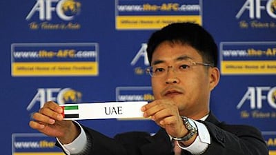 An AFC official displays the UAE at the Asian section of the London 2012 Olympic draw.