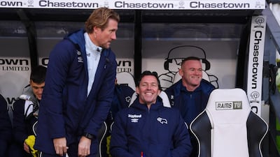 Wayne Rooney watches the Derby v QPR match from the dugout. Getty Images