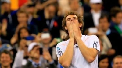 No dancing. No crying. Andy Murray celebrated his first grand slam title by putting his hands in front of his mouth, looking up and crouching on the court. He later said he was a lot was going through his mind.