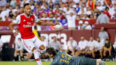 Real Madrid goalkeeper Thibaut Courtois stops a shot by Arsenal forward Pierre-Emerick Aubameyang. EPA