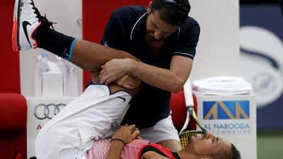 Nick Kyrgios of Australia receives treatment during his semi final match against Stanislas Wawrinka of Switzerland at the ATP Dubai Duty Free Tennis Championships, February 26, 2016. REUTERS/Ahmed Jadallah