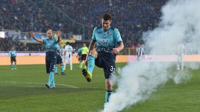 Hans Hateboer of Atalanta kicks a firework launched on the pitch during the Serie A match between Atalanta BC and Juventus at Stadio Atleti Azzurri d'Italia in Bergamo, Italy. Getty Images