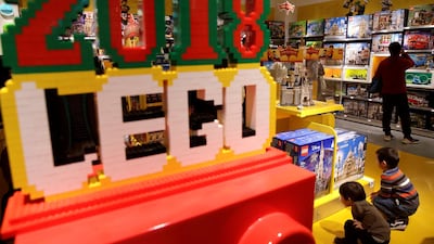 Children look at Lego boxes at a Lego store in Beijing, China. Jason Lee/Reuters