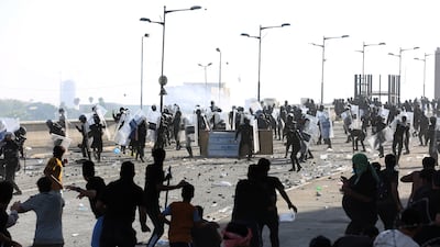 Iraqi protesters clash with anti-riot police during an attempt to storm the Green Zone in central Baghdad. EPA