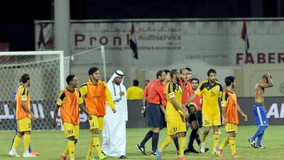 The Kalba camp in celebration after handing out a shock defeat to Al Nasr, in blue. Courtesy Mohideen / Al Ittihad