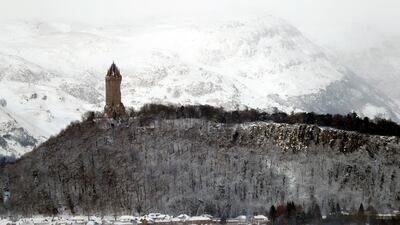 The Wallace Monument can be seen in the snow near Sterling, Scotland. Russell Cheyne / Reuters