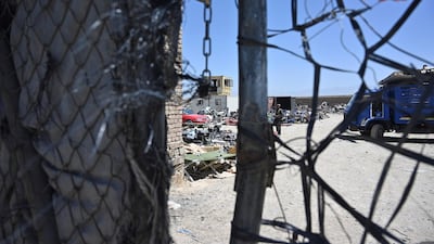 A man stands at a junkyard near the Bagram Air Base. AFP