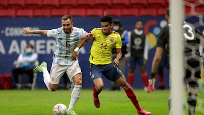 Luis Diaz, right, battles for the ball with Argentina's German Pezzella before scoring his side's opening goal.
