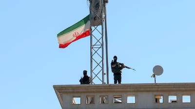 Armed security guards keep watch from the rooftop of the Iranian embassy in Beirut, Lebanon, during a commemorative rally for the Iranian supreme leader Ali Khamenei in April 2026. EPA