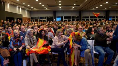 People attend a campaign meeting of Spain's far-right party VOX in Granada. AFP