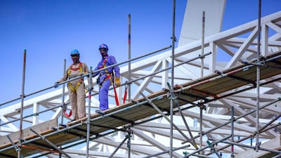 Workers pictured on scaffolding during a site visit on Wednesday