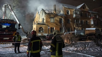 Ukrainian rescuers work at the site of a Russian strike on a residential building in Kyiv. EPA