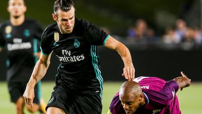 Real Madrid's Gareth Bale battles with Manchester City defender Vincent Kompany during their International Champions Cup pre-season friendly match at the Los Angeles Memorial Coliseum in July 2017. AFP