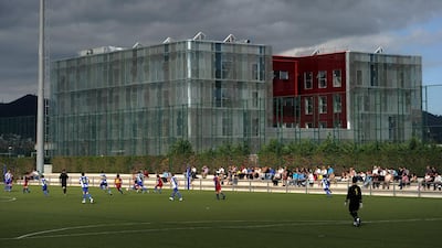 In this file photo, youth players of Barcelona and Espanyol play beside the newly built dormitories for Barcelona youth players, on one of the pitches at the Joan Camper training ground on May 15, 2011 in Barcelona, Spain. Every weekend various teams of Barcelona youth players play in matches with the hope of one day making it to the top. Jasper Juinen / Getty Images