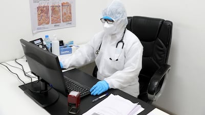 General practitioner Dr Sugandhna Malan processes travellers as they rush to get a test 48 hours before they fly. Chris Whiteoak / The National