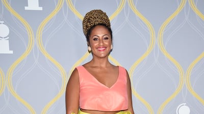 American theatre director Lileana Blain-Cruz sports a crop top and ruffled yellow skirt. Invision / AP