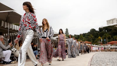 The Chanel cruise 2022/23 collection is jaunty and upbeat, with plenty of clashing patterns and relaxed silhouettes. Photo: EPA