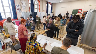 French citizens wait to cast their ballot. EPA