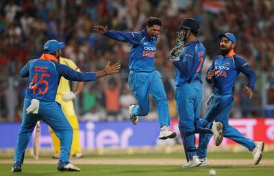 Kuldeep Yadav, second left, has burst onto the scene for India, taking a hat-trick against Australia at Eden Gardens in Kolkata. Adnan Abidi / Reuters