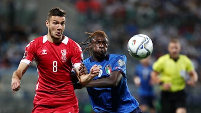 Moise Kean of Italy battles for possession with Edgaras Utkus of Lithuania. Getty Images