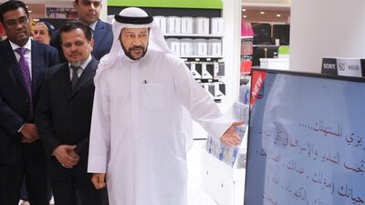 Dr Hashem Al Nuaimi, manager of consumer protection at the Ministry of Economy, with Abu Bak’r T.P (left) and Saifee Rupawala (centre), chief executive of Lulu International Group, at the inauguration of the event. Delores Johnson / The National