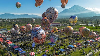 Hot air balloons decorated with traditional motifs are prepared for launch during the annual balloon festival held to celebrate Eid Al Fitr at Semayu village in Wonosobo, Central Java, Indonesia. AFP