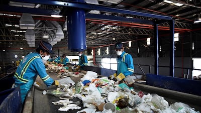 A workforce of sorters and machines work together to sift out rubbish that could be recycled or treated instead of sent to landfill