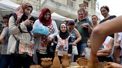 A laborer works at a traditional clay pots during Cherry Day in the village of Hammana, southeast of Beirut, Lebanon. EPA