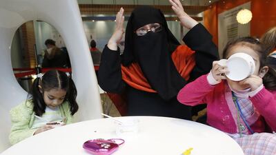 Brenda talks while her daughters eat ice cream in Westfield, east London. Brenda, who is originally from Mexico, converted from Catholicism when she came to London. Brenda has always lived a strictly religious life. She thought about becoming a nun before she realised she wanted children. She says ‘I know I’m in a non-Muslim country and so I try to respect the rules. Sometimes people say nice things about my children or they smile at me and I try to smile back at them. I know they can’t see my face but I hope they know I’m smiling with my eyes.’