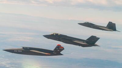 A F-22 Raptor and F-35A Lightning II fly in formation with the XQ-58A Valkyrie. Photo: US Air Force
